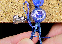 detail photo showing techniques of finger weaving by Robin Atkins, bead artist