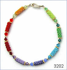 Matte rainbow bracelet by Robin Atkins, bead artist.