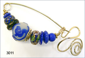 fibula pin by Robin Atkins, bead artist.